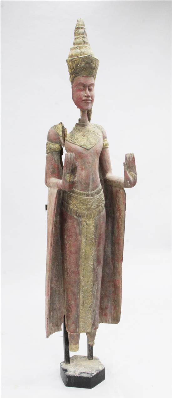 An Eastern parcel gilt and painted wood model of a standing female figure, 5ft 8in.